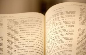 open bible book close up on blurred background