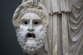 sculpture with antique mask