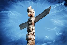 Totem Pole at blue abstract background