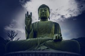 Beautiful, bronze Chungnam statue, under cloudy sky