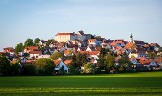 church on a hill among the houses of the village