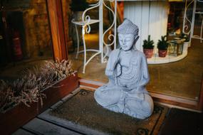white buddha statue in the interior