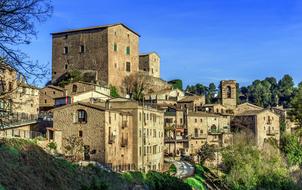 Old city buildings on the beautiful green hills