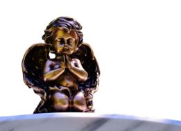 small praying angel figure