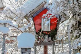 snowy Cross Candle at Winter Wayside