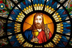Beautiful and colorful, decorated altar window with Jesus in Delsbo, Sweden