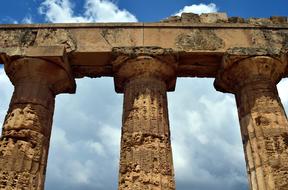 Beautiful, columns of the temple, at blue sky with white clouds on background, in Selinunte, Sicily, Italy