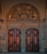 stone relief over the wooden doors of the church