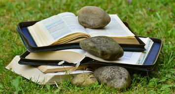 stones with holy books on a heap
