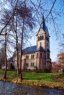 old church in rural landscape at fall, germany, bach