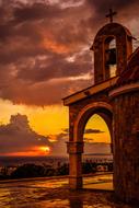 arch near the church at dusk