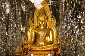 golden buddha statue in an ancient temple in Thailand