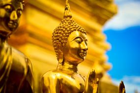 Beautiful gold statue in Wat Phra That Choeng Chum in Sakon Nakhon, Thailand