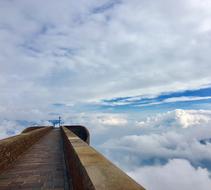 Beautiful architecture on the Monte Tamaro in Switzerland, among the white clouds, at blue sky on background