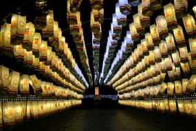 corridor of paper chinese lanterns at night