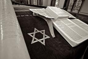 Black and white photo of the Star of David, near the books in Brighton Synagogue