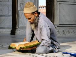 faithful man with Quran