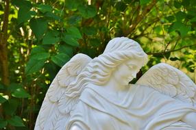 stone sculpture of an angel on a tomb