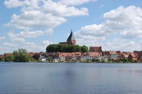 distant view of historic architecture on the lake in Molln