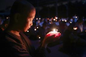 Nun With Candle