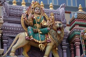 female deity riding lion, Sculpture, Singapore