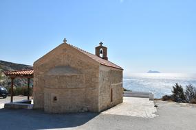 stone chapel by the sea on the island of Crete