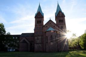 sunshine on the monastery church with spiers