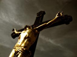 crucifixion at stormy clouds, low angle view