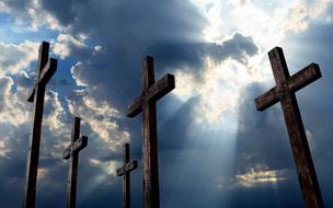 five Crosses beneath cloudy sky