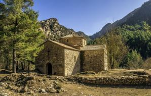 stone church in the mountains on a sunny day