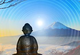 Buddha statue on the background of a snowy mountain