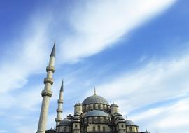 Beautiful and colorful mosque, with the minarets, in Ä°stanbul, Turkey, under the blue sky with white clouds