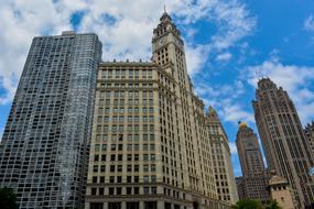 tower with a spire and clock in chicago architecture