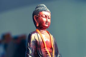 Beautiful shiny and colorful bronze statue of Buddha