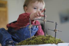 baby with Easter crosses