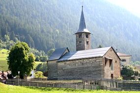 Church in village at forested mountain