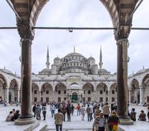 People in the square of beautiful Aya Sofia mosque in Istanbul, Turkey