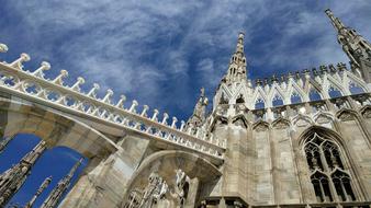 bottom view of the architectural elements of the cathedral in milan