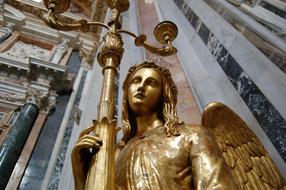 golden statue in the church of rome close up