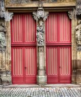 red church doors with portal