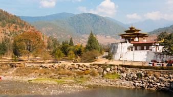 Beautiful landscape of the pagoda among the colorful plants in Bhutan