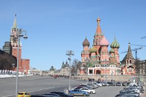 People, near the beautiful and colorful Kremlin in Moscow, Russia, at blue sky on background