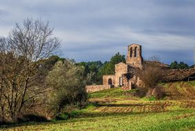 Beautiful landscape with the church among the colorful plants
