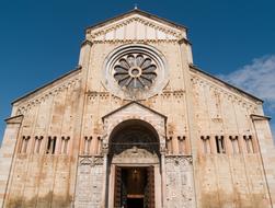 Beautiful church with beautiful window at blue sky background with white clouds