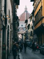 People on the beautiful street near the cathedral in Florence, Italy