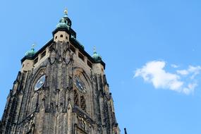 tower of gothic church on the blue sky