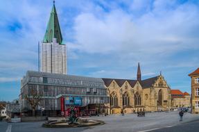 square in front of the cathedral with a green roof