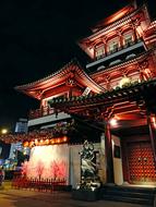 Beautiful and colorful Buddha Tooth Relic Temple with lights in Singapore, at night