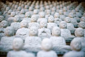 many white buddha sculptures