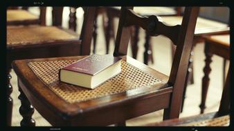 bible on empty chairs